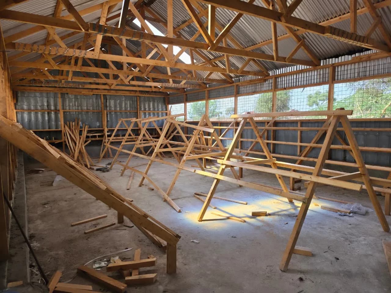 Roof trusses being assembled inside the new poultry house